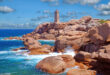 a lighthouse on a rocky beach